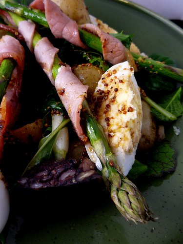 Black Pudding & Duck Egg Warm Salad - Girl interupted eating - The Real Lancashire Black Pudding Co